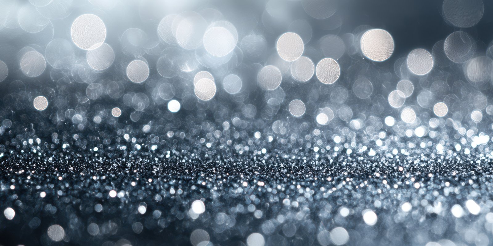 Shimmering silver and blue glitter background with sparkling bokeh effect during festive celebration